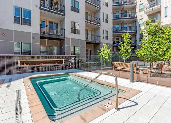 A small pool in a courtyard surrounded by buildings at Regatta Sloans Lake Apartments, Colorado, 80204