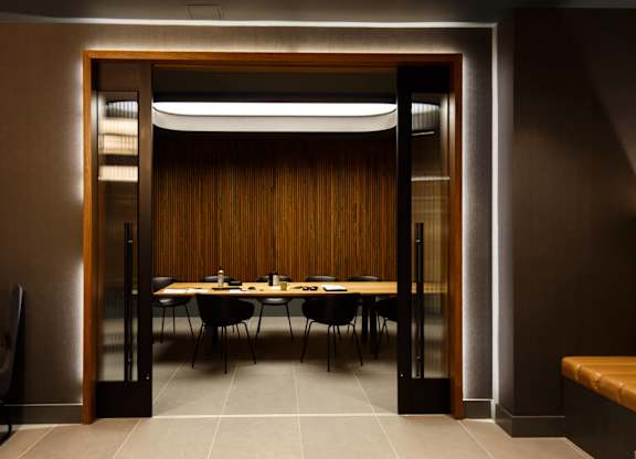 a dining room with a table and chairs
