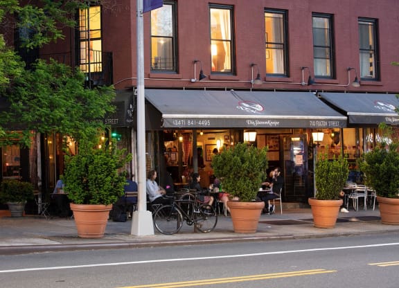 a street view of a restaurant on a city street at The Paxton, Brooklyn, NY 11201
