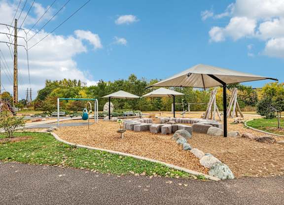 A playground with a swing set and a slide.