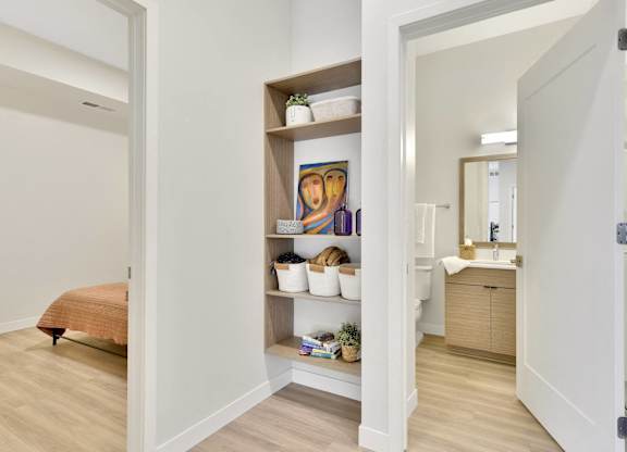 A bathroom with a towel on the floor.