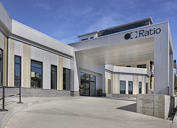 The image shows a modern building with the name "CRatio" on it.