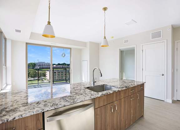 a kitchen with granite counter tops and a sink