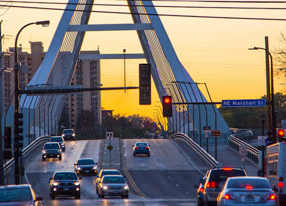 the traffic on a bridge at sunset