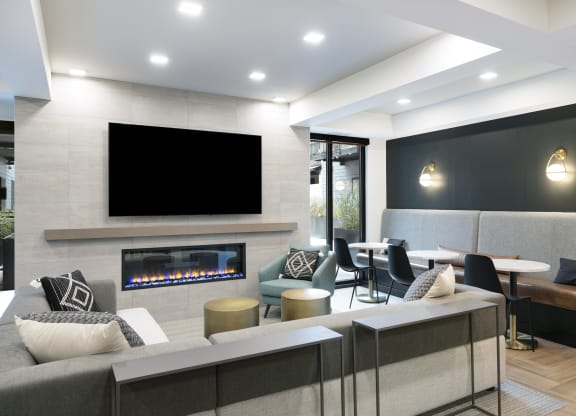 a living room with a fireplace and a large screen tv