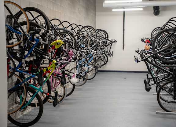 A bike rack full of bicycles.