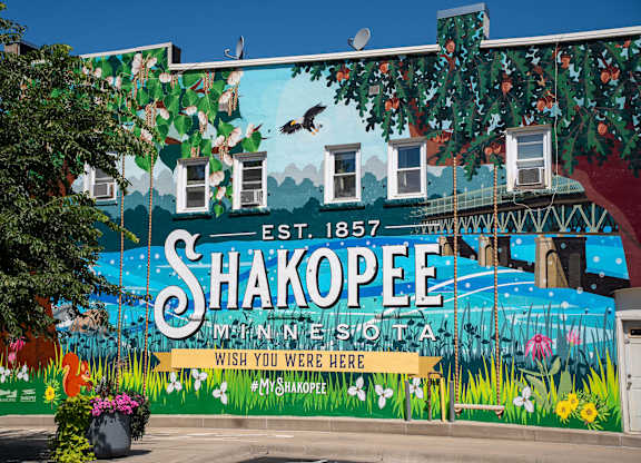A mural on a building in Shakopee, Minnesota, with the text "Est. 1857" and "Wish you were here".