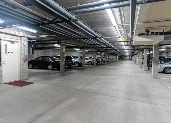 a parking garage with cars parked in it