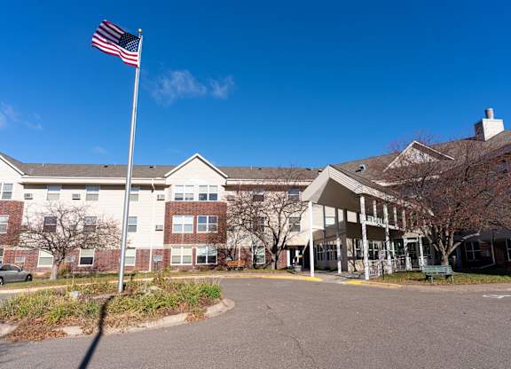 an flag flying in front of a building