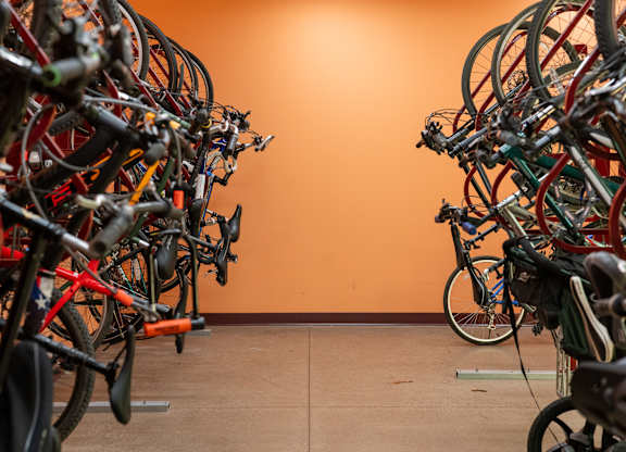 A bike rack full of bicycles.
