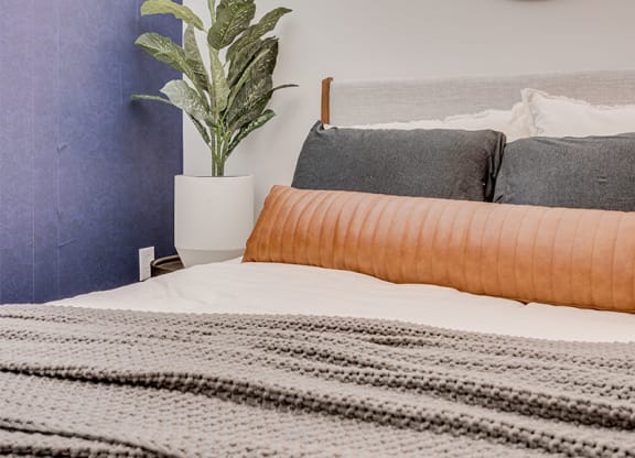Bedroom with large bed and mirror