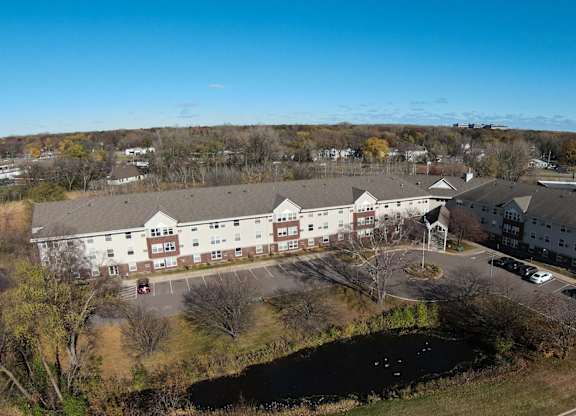 an aerial view of several buildings in a parking lot