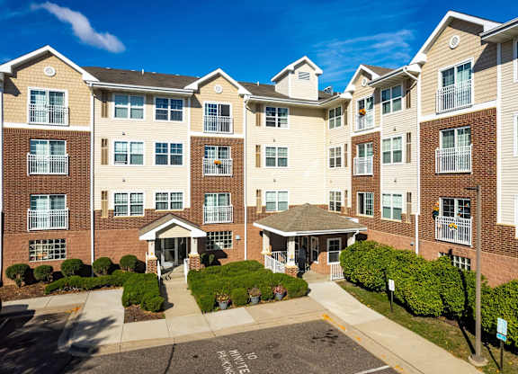 A large apartment complex with a courtyard in the middle.