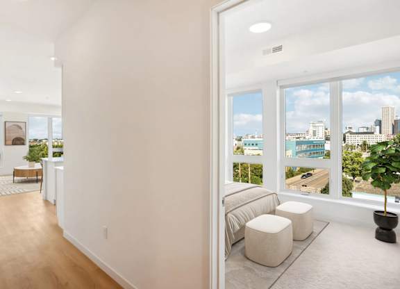 A living room with a view of the city.