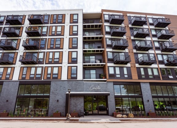 the facade of a condo building with a front entrance