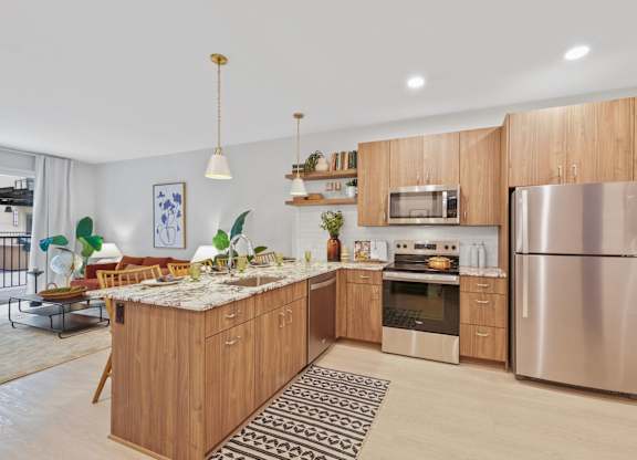A modern kitchen with wooden cabinets and stainless steel appliances.