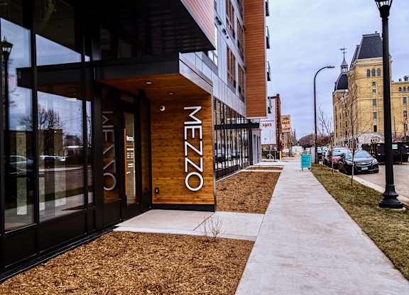 The entrance to a building with the word "MEZZO" on it.