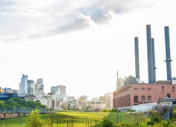 a view of the skyline of the city from a park