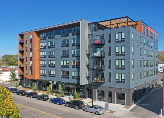 an aerial view of an apartment building on a city street