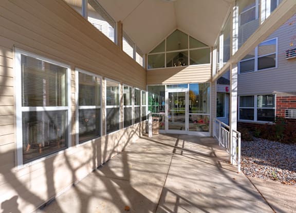 A sunny day at the outdoor seating area of a building.