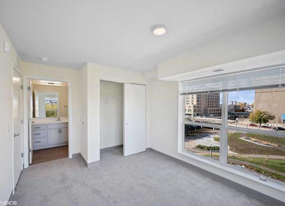 a living room with a large window and a view of the street