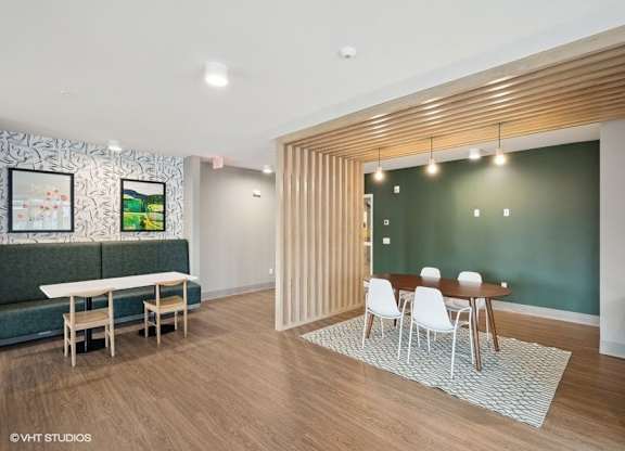 a living room with a bar and a dining room