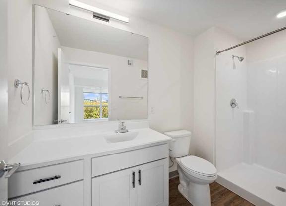 a bathroom with a sink toilet and a shower