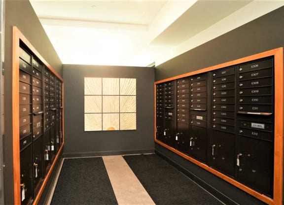 a large locker room with many lockers and a window