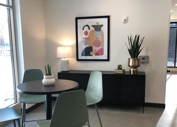 a dining room with a glass table and a chair