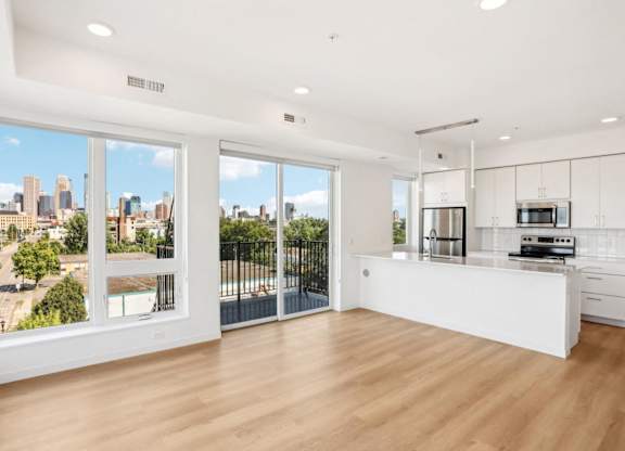 A modern kitchen with a view of the city.