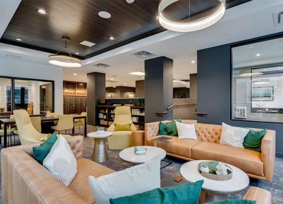 a large living room with couches and tables