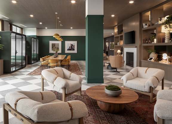 A living room with a checkered floor and a green column.