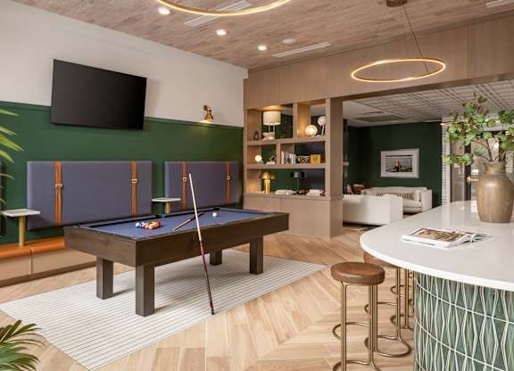 A room with a pool table and a bar.