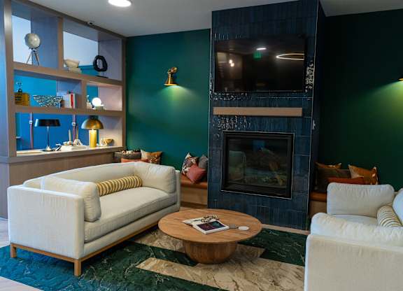 A living room with a fireplace and a couch.