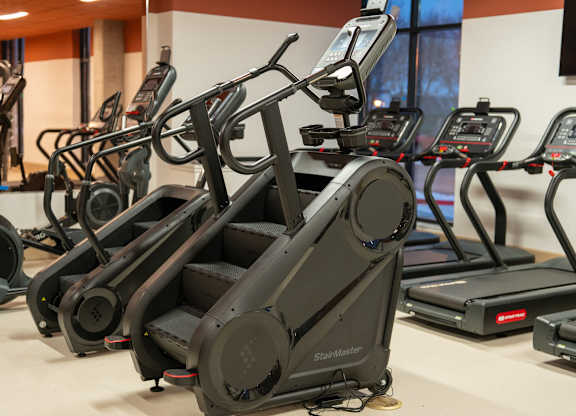 A Stalker brand treadmill is in a gym.