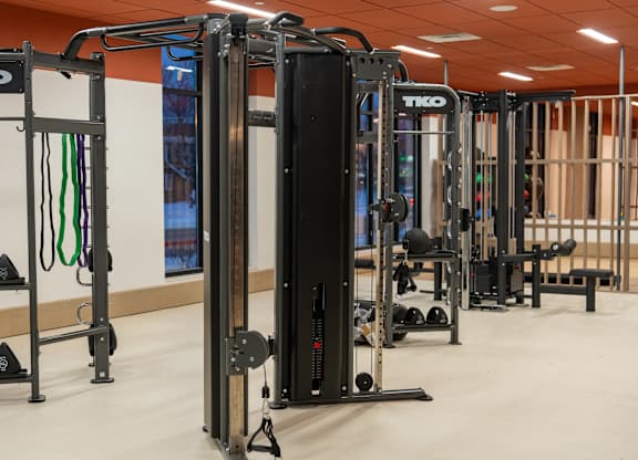 A gym with a TKO branded weight machine.
