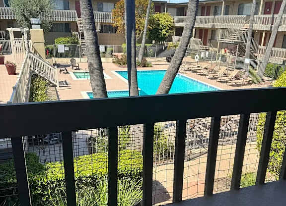 A view of a pool from a balcony.