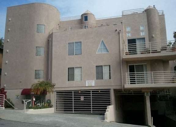 A large building with a balcony on the second floor.