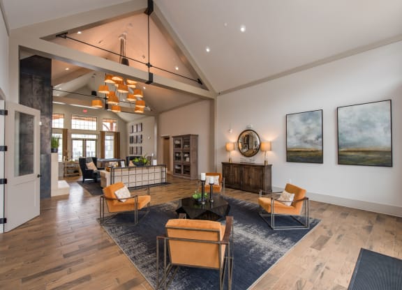 a large living room with a vaulted ceiling and hardwood flooring at The Whitworth, Williamsburg, VA