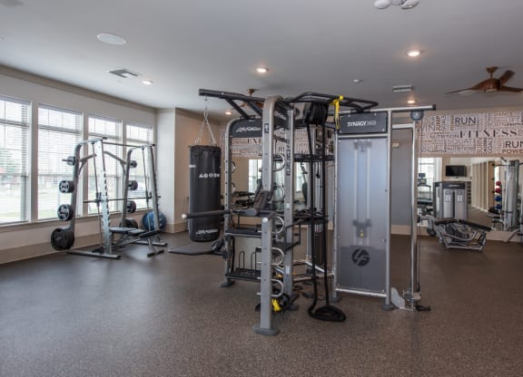 a fitness room with a lot of exercise equipment at The Whitworth, Williamsburg, 23185