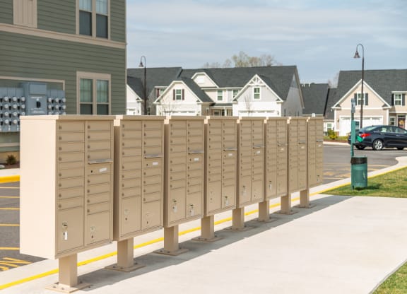 a row of mailboxes on a sidewalk in front of a house at The Whitworth, Virginia