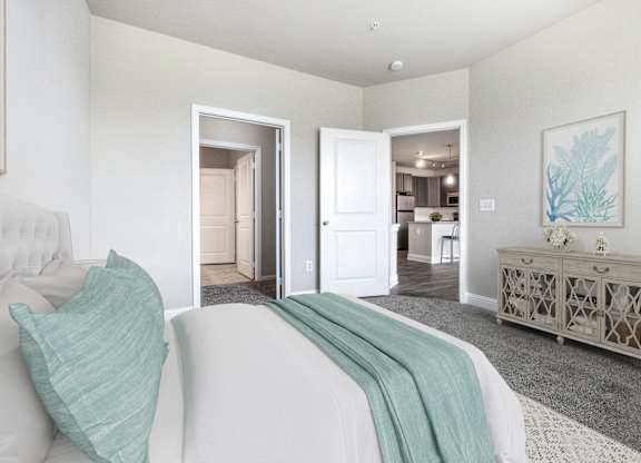 A bedroom with a white bed and a grey cabinet.
