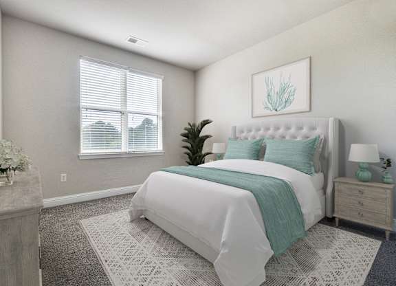 A bedroom with a large bed and a potted plant.