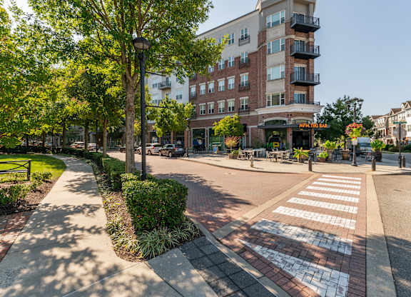 a city street with a building and a crosswalk