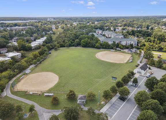 an aerial view of a baseball field in a city park