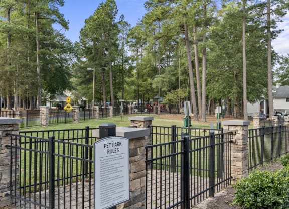 a cemetery with a fence and a sign in front of it at Trails at Short Pump Apartments, Richmond, VA, 23233