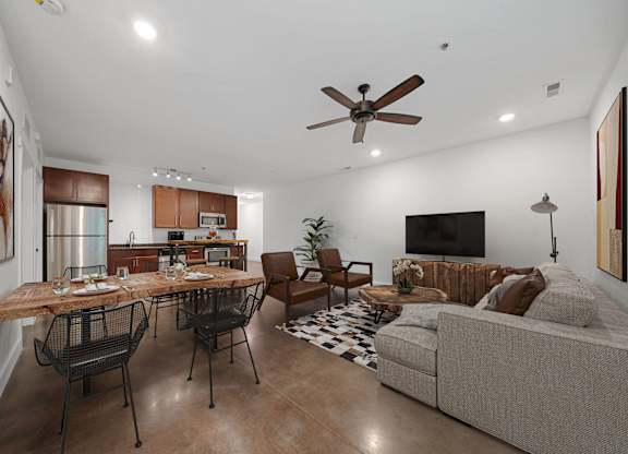 A modern living room with a dining table and chairs at Skyloft in Asheville, NC