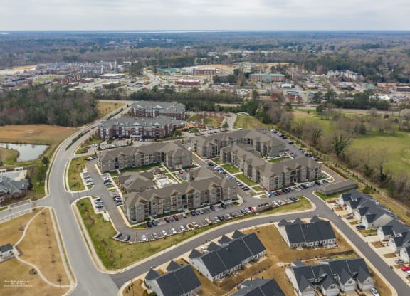 an aerial view of a large complex of houses in a suburb at The Whitworth, Williamsburg, 23185