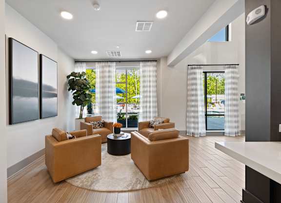 A living room with a large window and a view of the outside.