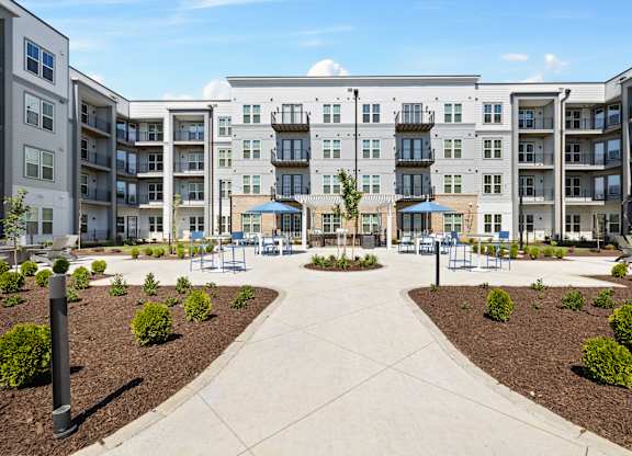 A large apartment complex with a courtyard in the middle.